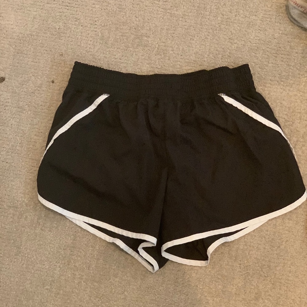 Running shorts with built in zipper pocket